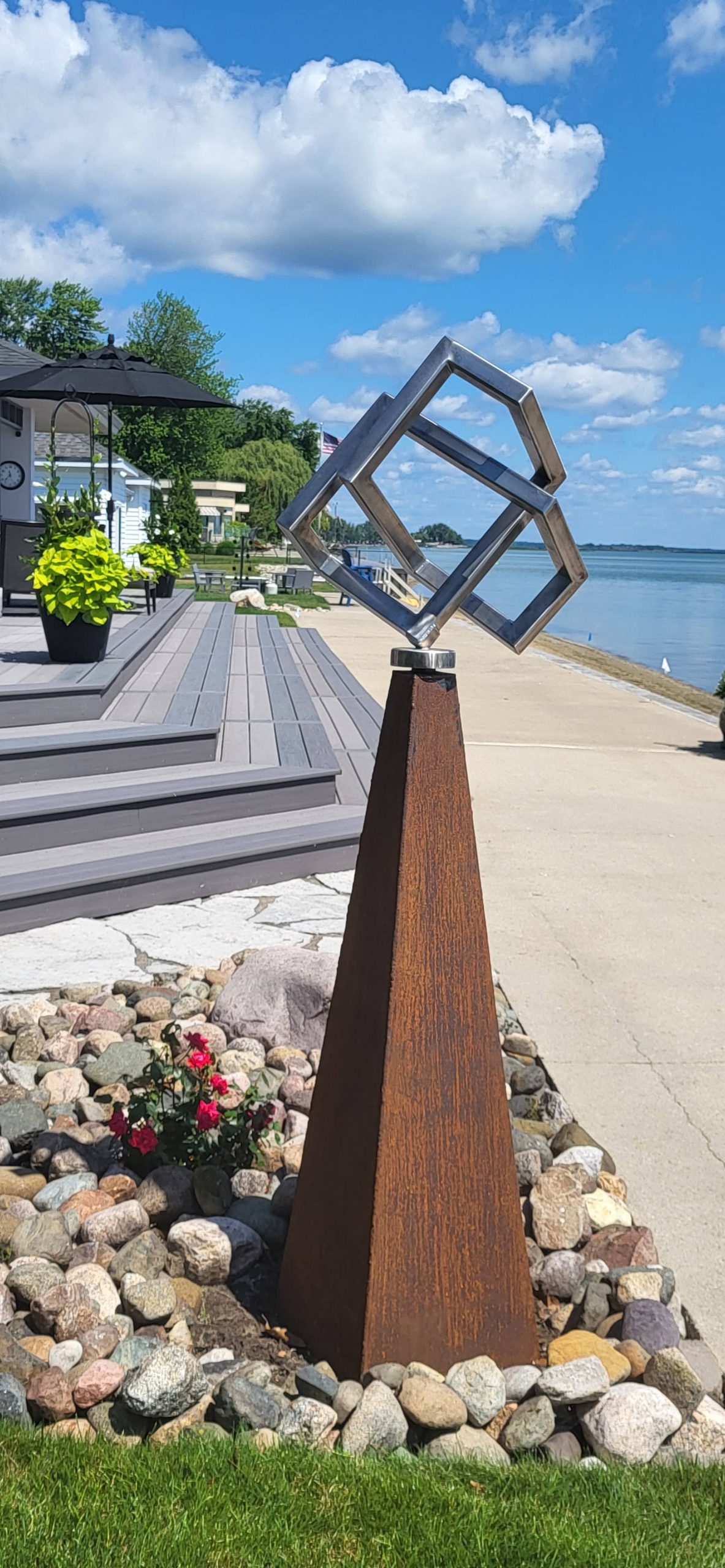 Original metal sculpture installed at a waterfront residence